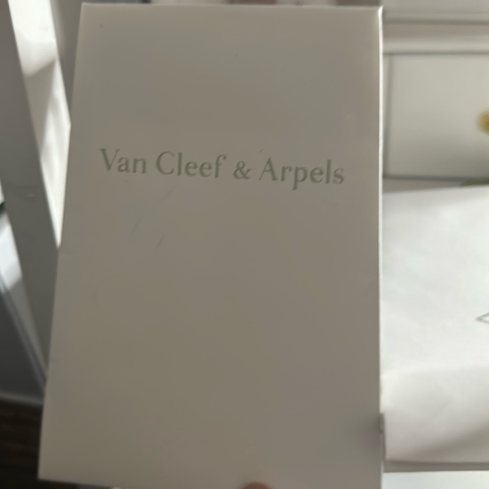 Two authentic VanCleef and Arpels shopping bag size small.